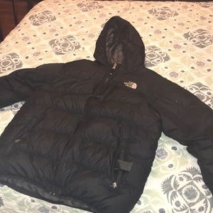 A black north face puffer jacket